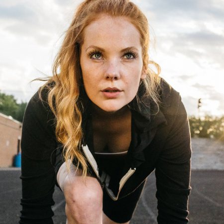 A woman starting a run while wearing an IontoPatch.